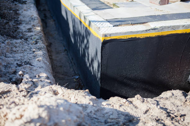 Professional Waterproofing technician working in Cambridge, MD